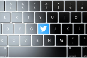 Bilde av tastatur, der en av knappene er byttet ut med en Twitter-logo